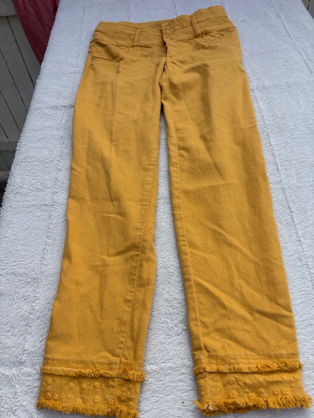 High-Rise Women's Jeans in Mustard Yellow with Frayed Hem